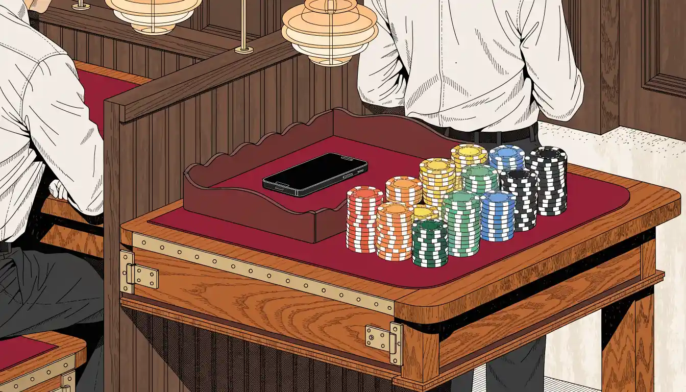 Casino cashier desk with chip stacks and face-down smartphone in an upscale British casino